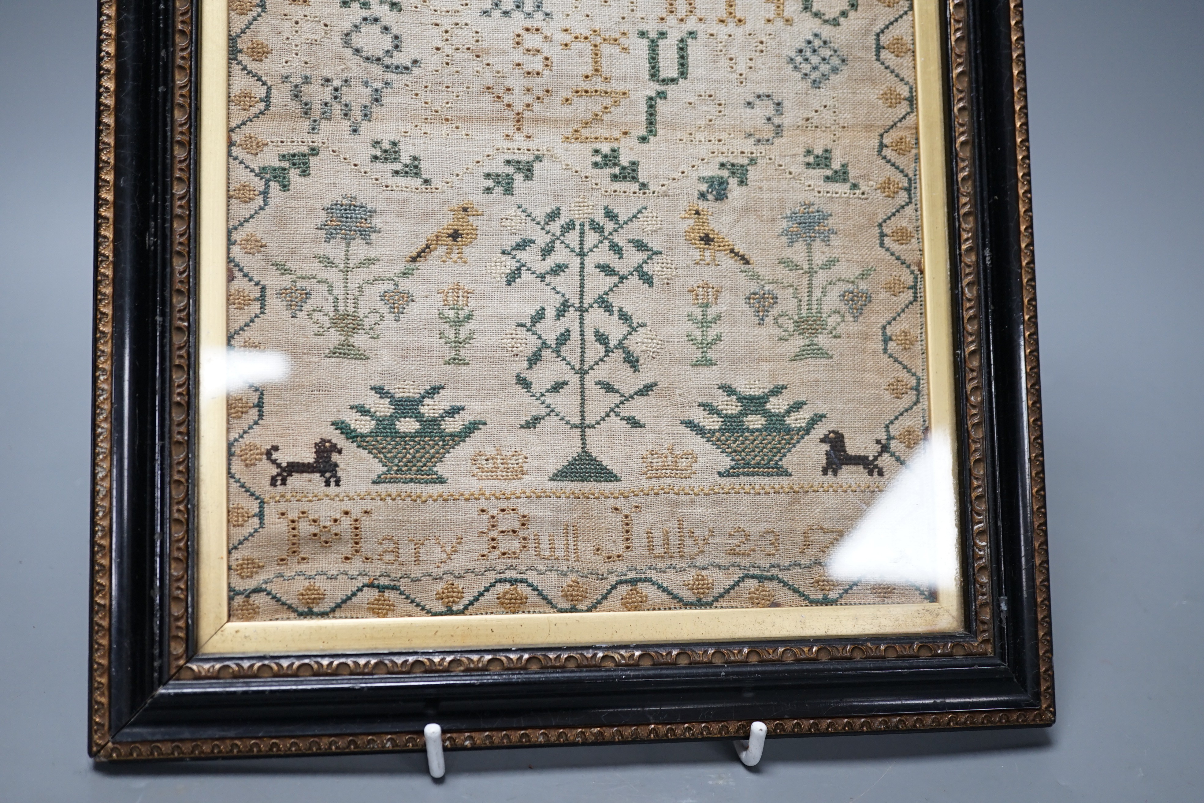 A George III sampler by Mary Bull, dated July 23 1799, 18cms wide x 23.5 high